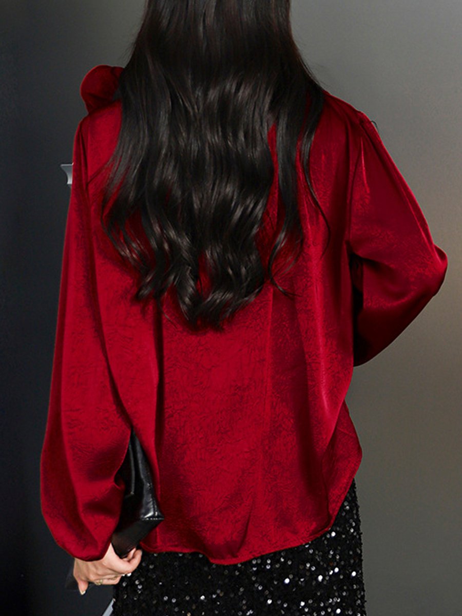 Stylish Wrap Blouse with Floral Accent