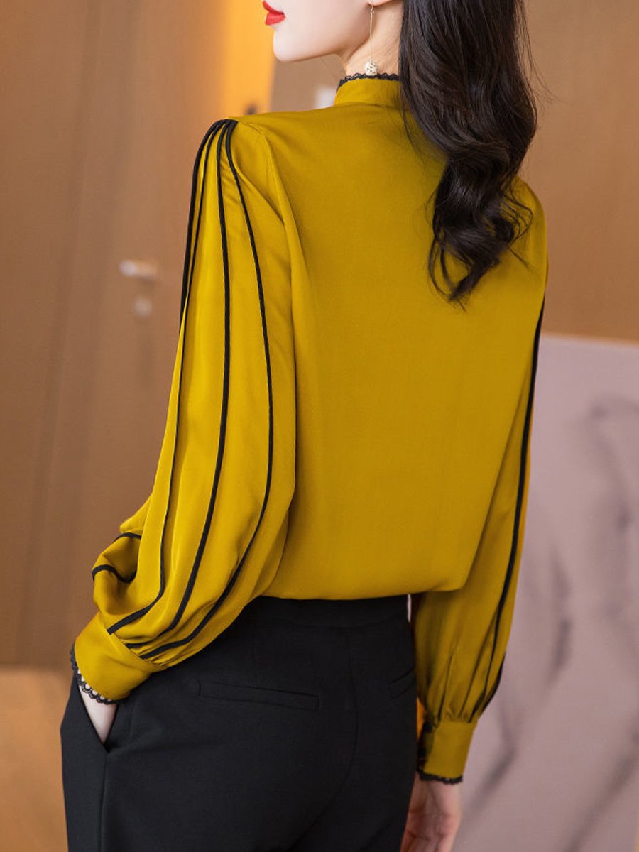 Elegant Blouse with Black Trim Accents